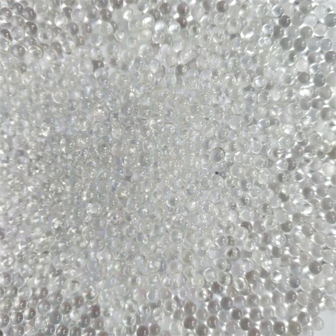 Adhesive reflective glass beads